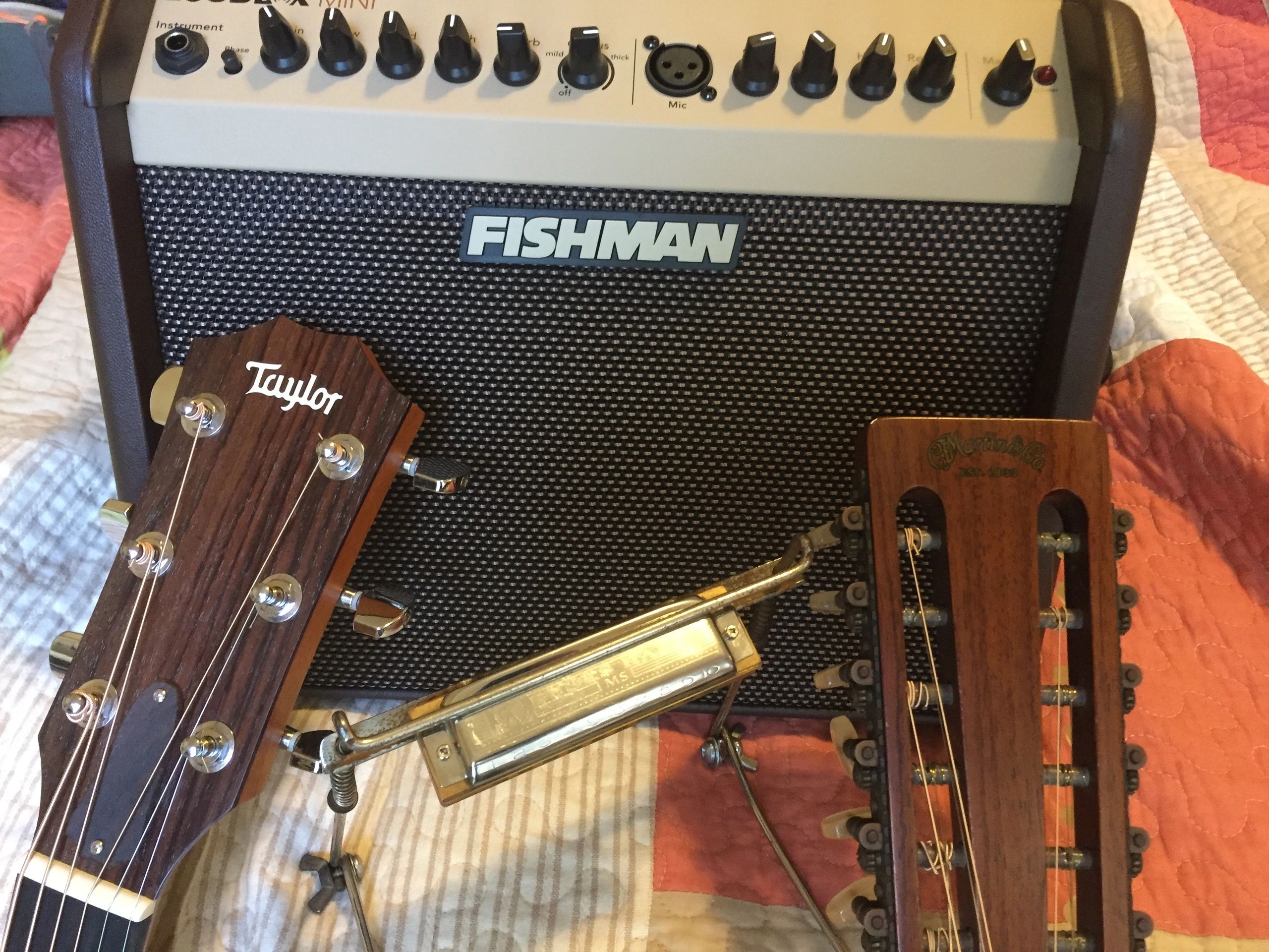 Fishman amplifier with Taylor and acoustic guitars